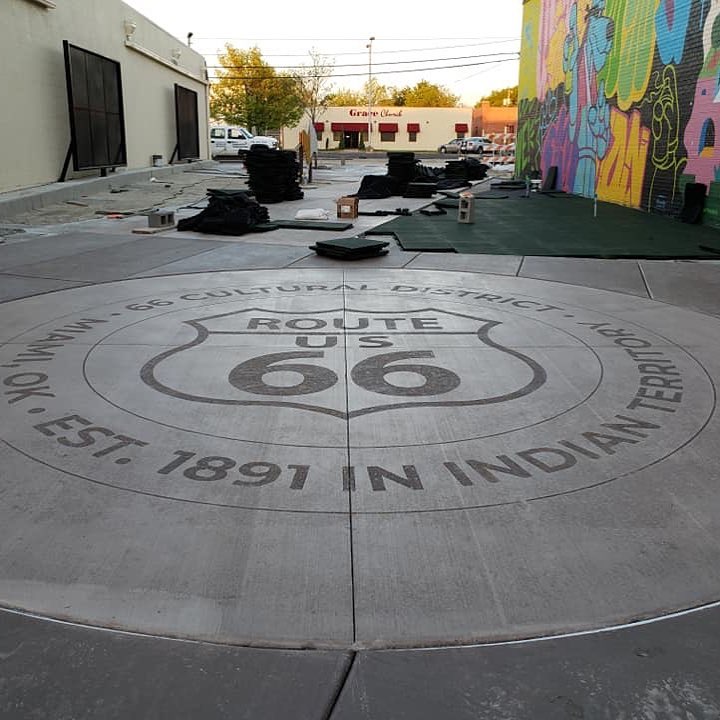 Route 66 design engraved into an exterior commercial concrete entry