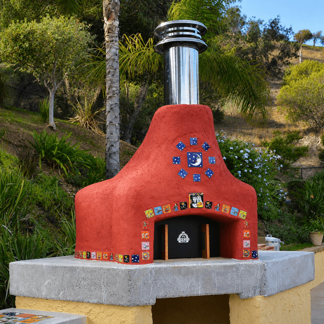 J. Larson pizza oven with vivid red stucco finish