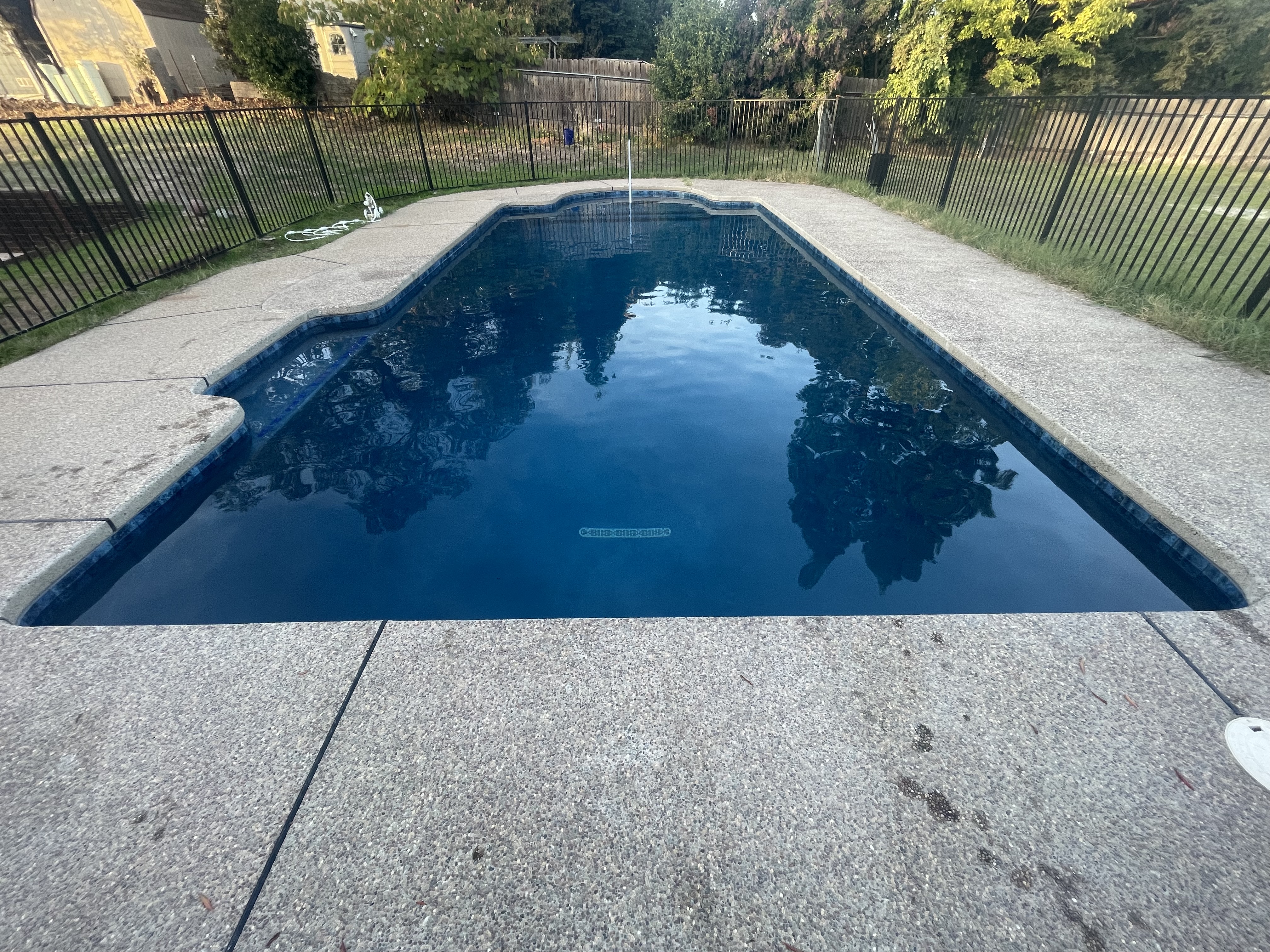 Backyard after transformation with pool and outdoor living