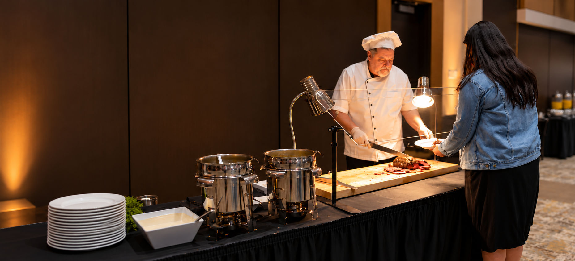 Chef serving a guest at a Terre Haute Convention Center action station