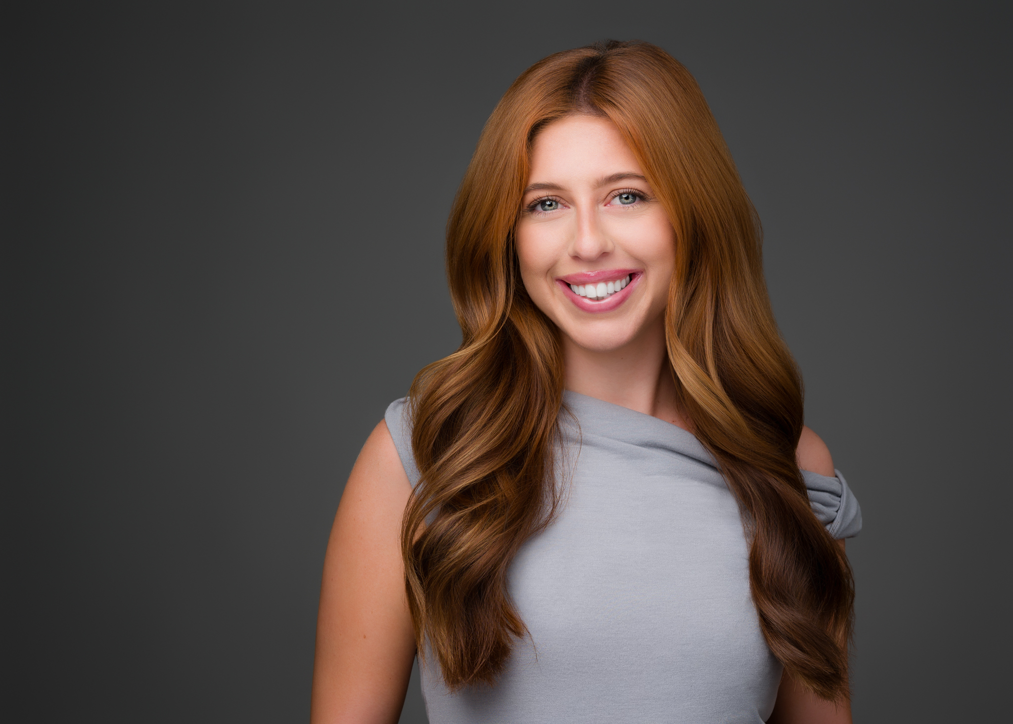 Individual professional headshot session — studio portrait of confident professional