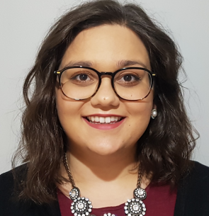 headshot of Yasmine, smiling at the camera