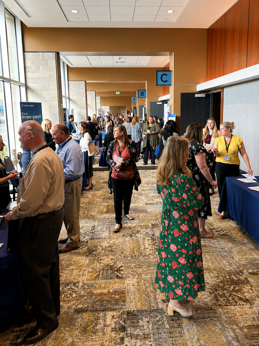 Guests networking in the Terre Haute Convention Center pre-function space