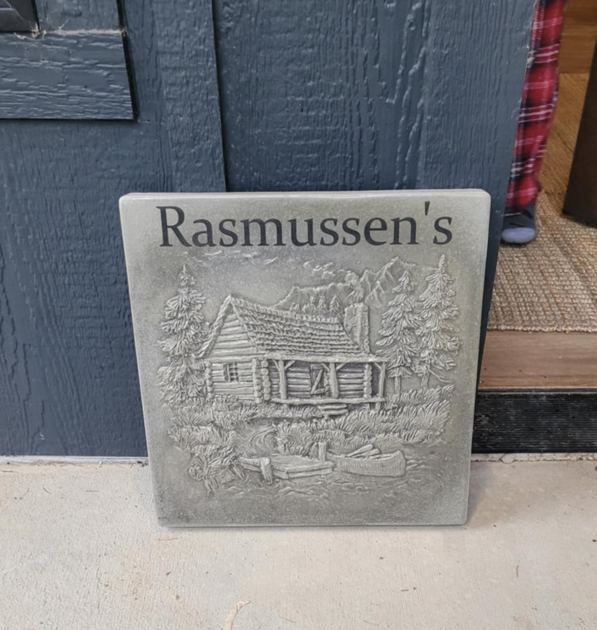 Custom cabin engraving on a garden stone